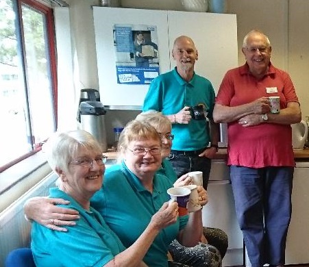 Volunteers drinking tea